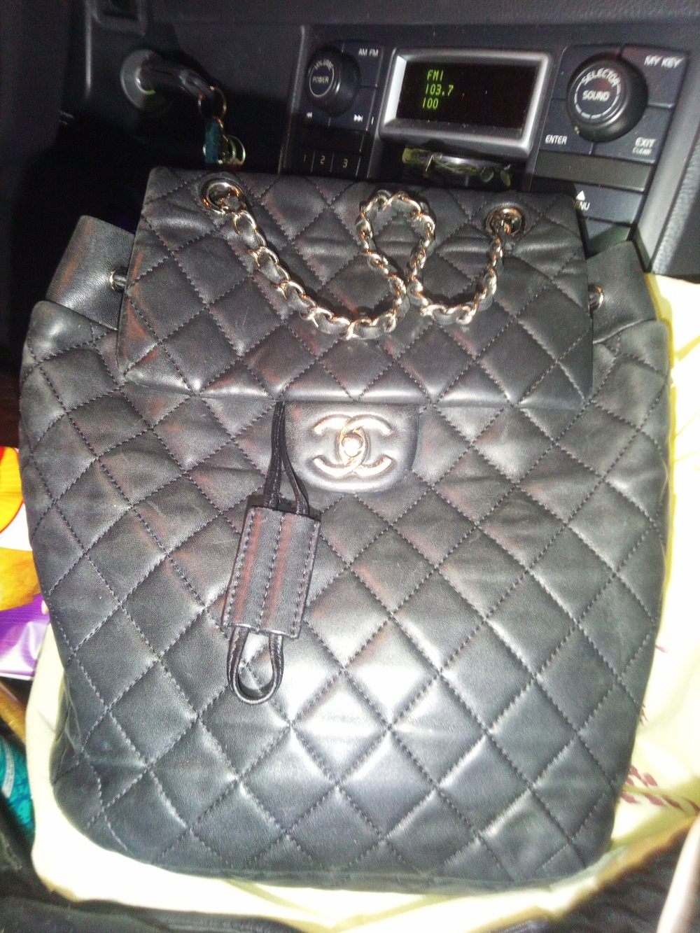 CHANEL Black Quilted Leather Backpack with Chain-Detail Straps